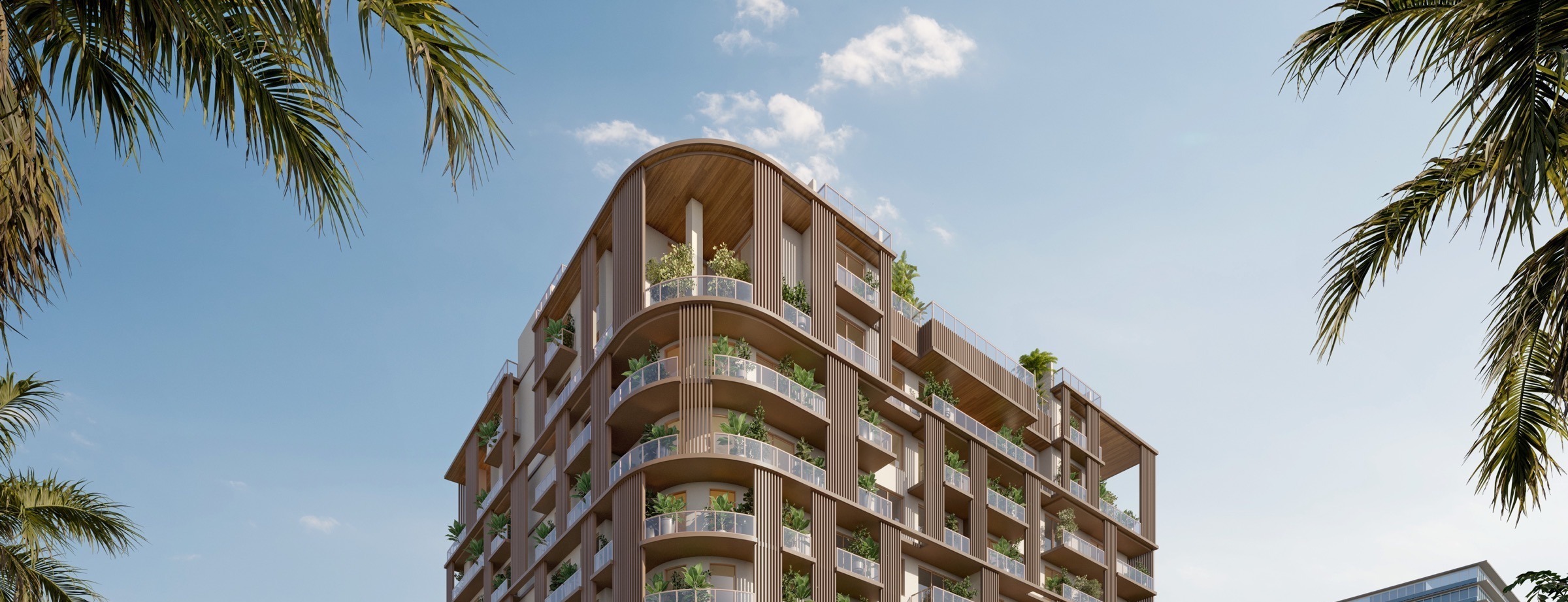 Daytime corner view of The Lincoln Coconut Grove Residences — the contemporary façade rising quietly above the tropical canopy of the Grove.