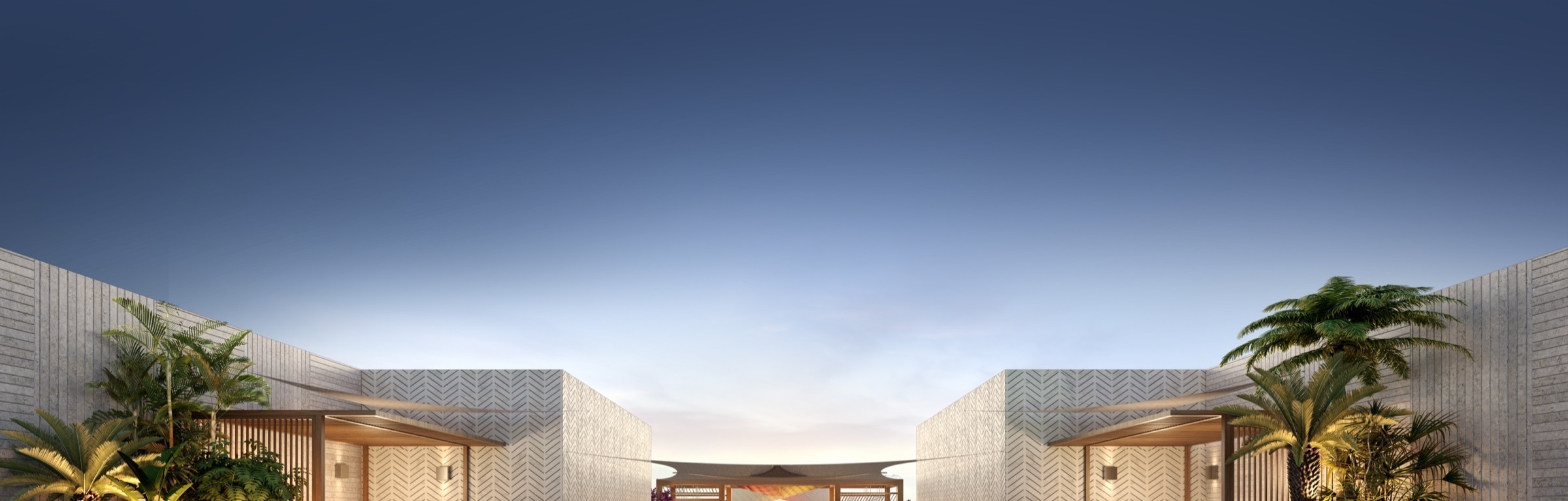 Rooftop pool at dusk at The Lincoln Coconut Grove Residences — atmospheric lighting, lounge seating, panoramic views over the Coconut Grove canopy.